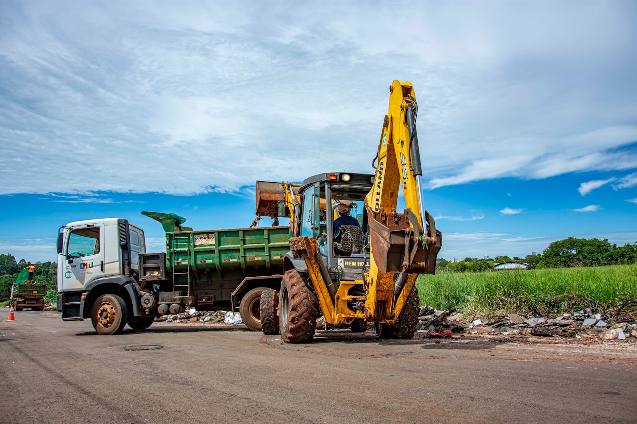 services-04 Excavator and truck clearing rubble in Londrina, Brazil outdoors.